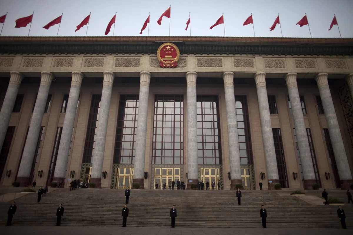 Chinese soldiers dressed as ushers guard the stairs outside the Great Hall of the People in Beijing, China, March 5, 2012. (AP Photo/Alexander F. Yuan)