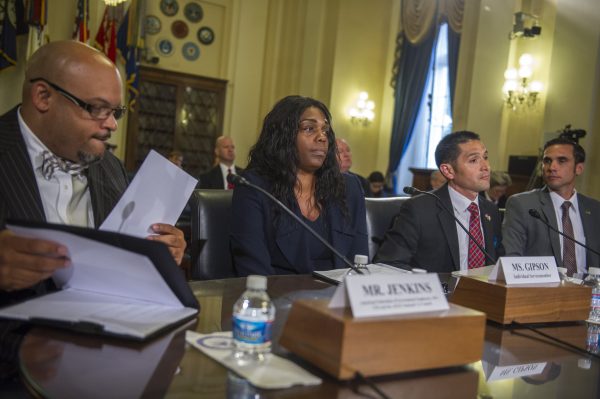AFL-CIO and AFGE National VA Council, Eric Jenkins (left) is joined by former Army Capt. Debra Gipson (second from left) National MEB/PEB Representative, The American Legion, Gerardo Avila (second from right) and Assistant National Legislative Director, Disabled American Veterans, Paul Raymond Varela (right) during a House Veterans' Affairs Committee, Disability Assistance and Memorial Affairs Subcommittee hearing on 'Defined Expectations: Evaluating VA's Performance in the Service Member Transition Process' in the Cannon House Office Building, May 29, 2014, in Washington, DC. Ms. Gipson suffered a severe back injury while en route to Afghanistan. (Rod Lamkey/Getty Images)