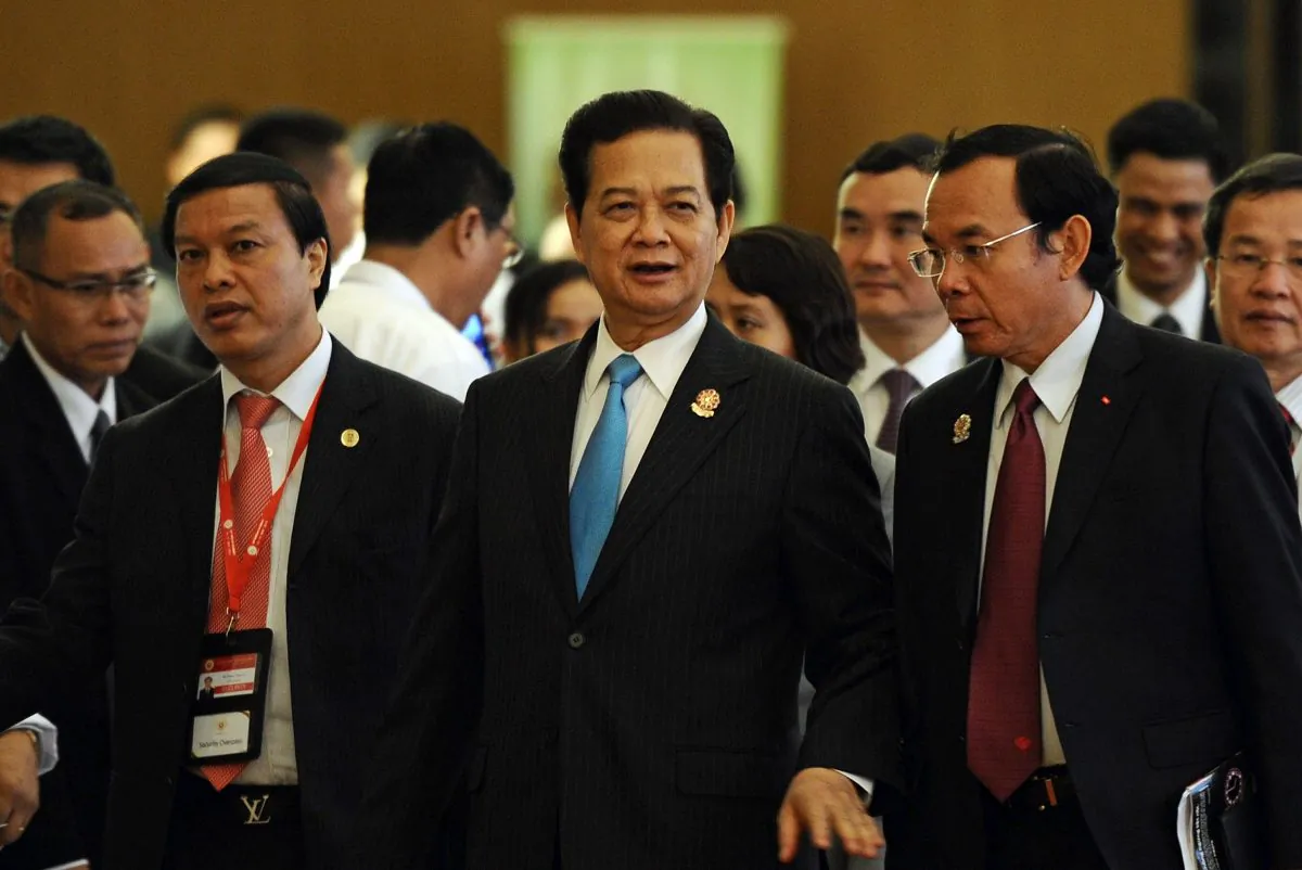 Vietnam's Prime Minister Nguyen Tan Dung (C) walks along with members of his delegation during the ASEAN summit at the Myanmar International Convention Center in Naypyidaw on May 11. On Sunday he criticized China's aggression in the South China Sea. (CHRISTOPHE ARCHAMBAULT/AFP/Getty Images)