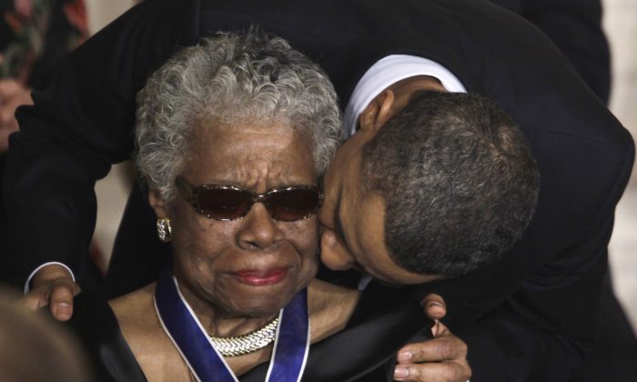A poem that's titled "When I Say I Am a Christian" was not written by Maya Angelou, but a number of people have shared it and mis-attributed it to her. In this Feb. 15, 2011 file photo, President Barack Obama kisses author and poet Maya Angelou after awarding her the 2010 Medal of Freedom during a ceremony in the East Room of the White House in Washington. Angelou, author of "I Know Why the Caged Bird Sings," has died, Wake Forest University said Wednesday, May 28, 2014.  She was 86. (AP Photo/Charles Dharapak, File)