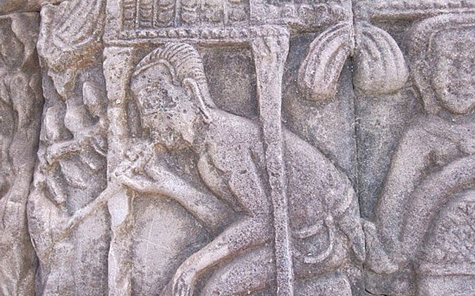 Ancient relief carving depicting drug use.