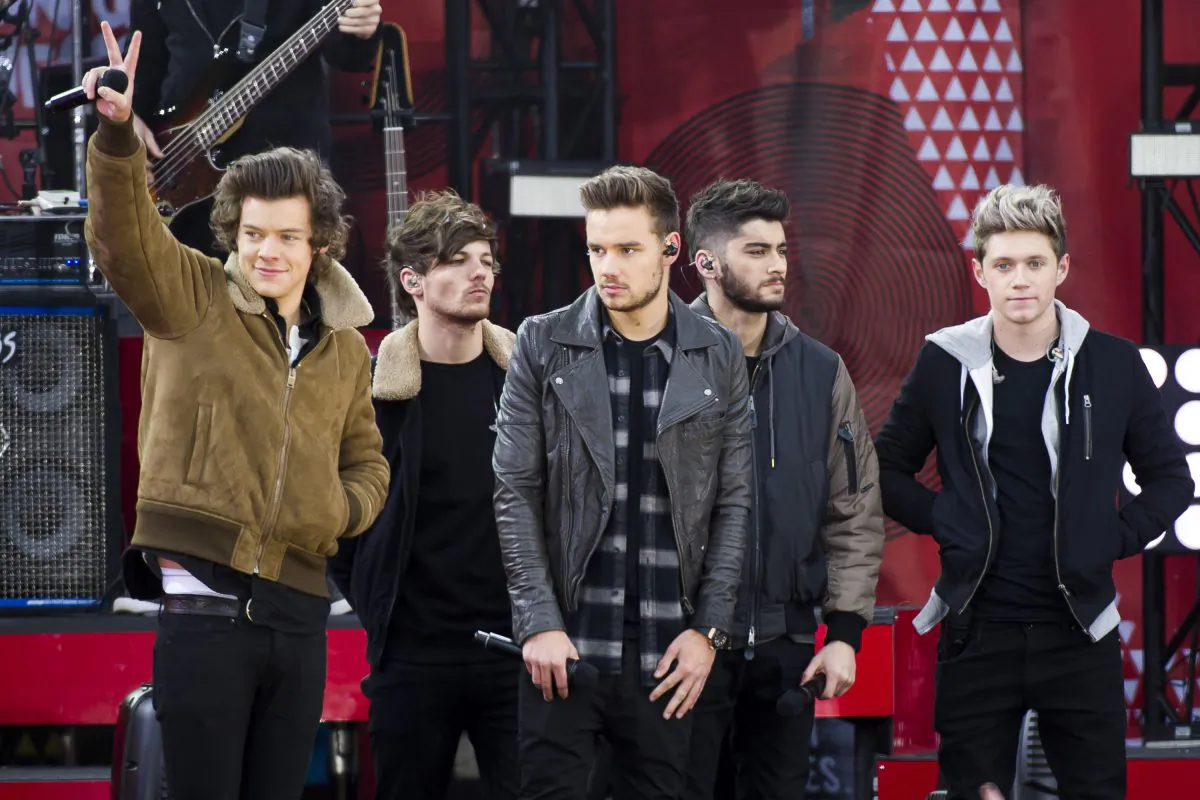FILE - This Nov. 26, 2013 file photo shows One Direction members, from left, Harry Styles, Louis Tomlinson, Liam Payne, Zayn Malik and Niall Horan on ABC's "Good Morning America"in New York. A representative for One Direction says the band’s lawyers are dealing with a video showing two band members smoking what the singers referred to as an “illegal substance.” British tabloid The Daily Mail posted a five-minute clip Tuesday, May 27, 2014, of Zayn Malik smoking and speaking with Louis Tomlinson, who is filming. (Photo by Charles Sykes/Invision/AP, File)