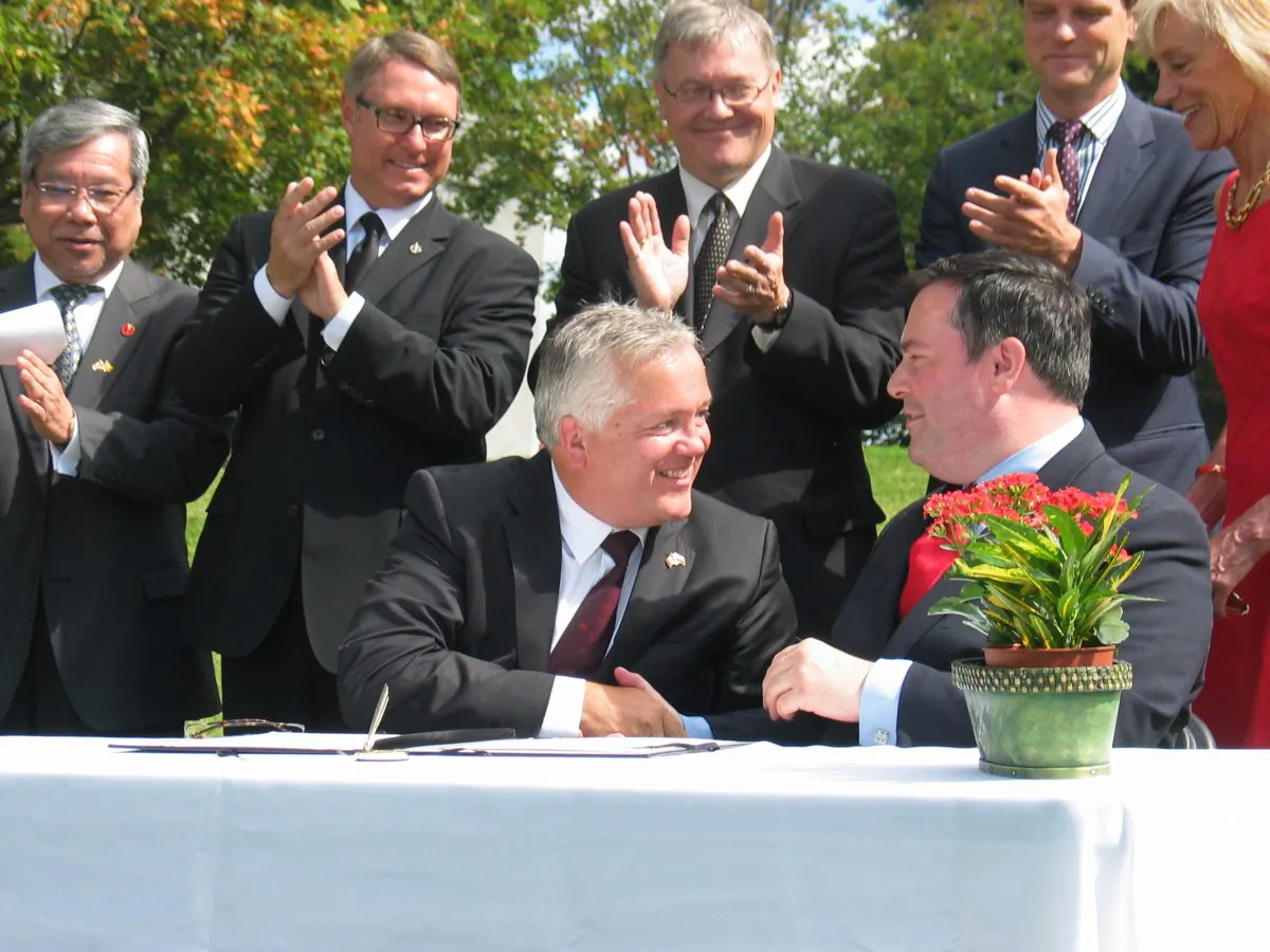 Tribute to Liberty chair Ludwik Klimkowski shakes hands with Employment and Multiculturalism Minister Jason Kenney on Aug. 23, 2013, at the site in Ottawa where a memorial to victims of communism will be built. An upcoming fundraising dinner to be attended by Prime Minister Stephen Harper aims to raise some of the $4 million needed to complete the project. (Courtesy Tribute to Liberty)