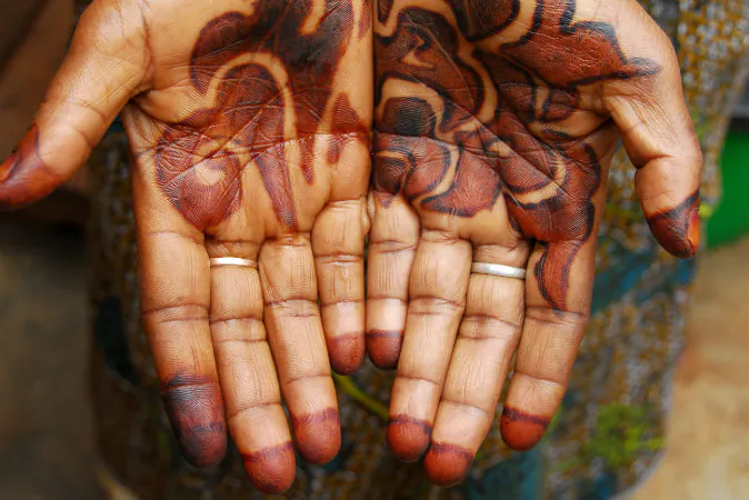 A Kenyan bride's hands tattooed with henna. Now, Kenyans can calculate the estimated "price" of their brides using an app. (Shutterstock*)