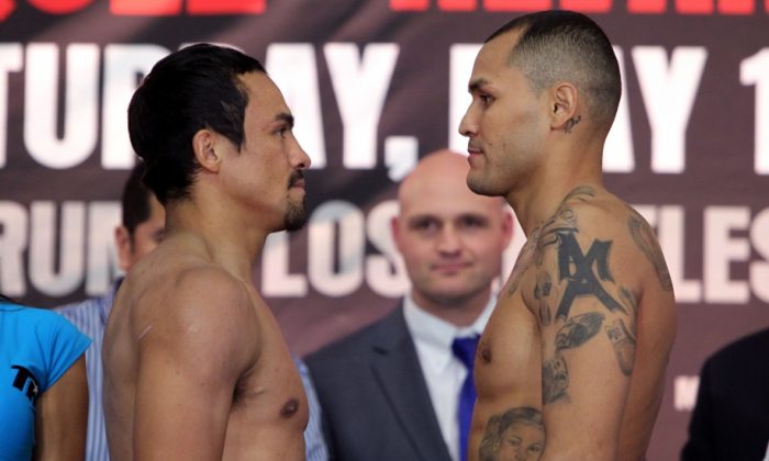 Juan Manuel Marquez (right) and Mike Alvarado (left) face-off after there May 16th weigh in.