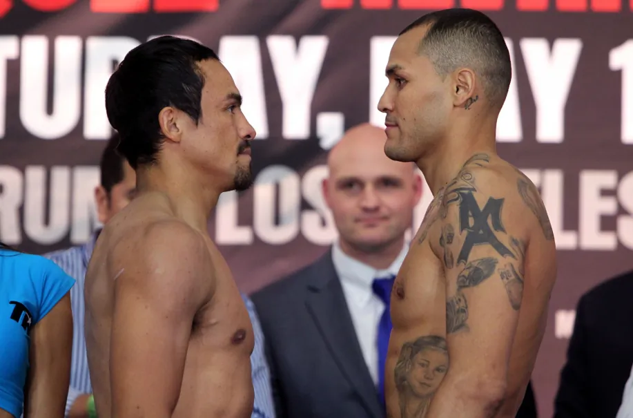 Juan Manuel Marquez (right) and Mike Alvarado (left) face-off after there May 16th weigh in.