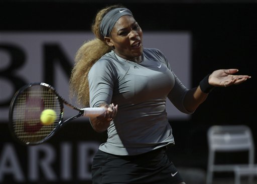 Serena Williams returns the ball to China's Shuai Zhang during their match at the Italian open tennis tournament in Rome, Friday, May 16, 2014. (AP Photo/Gregorio Borgia)