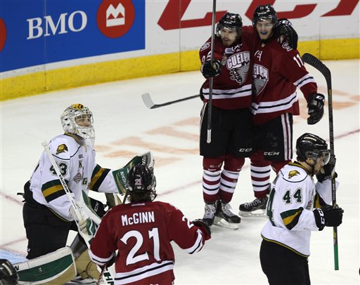 Guelph Storm players celebrate a goal against the London Knights during the first period in Game 6 of the CHL hockey Memorial Cup, in London, Ontario, Wednesday, May 21, 2014. (AP Photo/The Canadian Press, Dave Chidley)