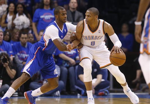 Oklahoma City Thunder guard Russell Westbrook (0) drives against Los Angeles Clippers guard Chris Paul (3) in the first quarter of Game 1 of the Western Conference semifinal NBA basketball playoff series in Oklahoma City, Monday, May 5, 2014. Los Angeles won 122-105. (AP Photo/Sue Ogrocki)
