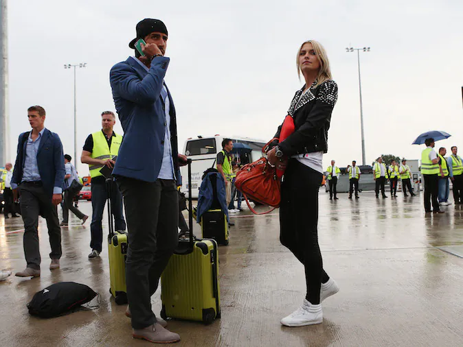Sami Khedira (L) and and his girlfriend Lena Gercke of Germany arrive at Frankfurt Airport following Germany's defeat to Italy in the semi-final of the UEFA EURO 2012 in Poland on June 29, 2012 in Frankfurt am Main, Germany. (Joern Pollex/Bongarts/Getty Images)