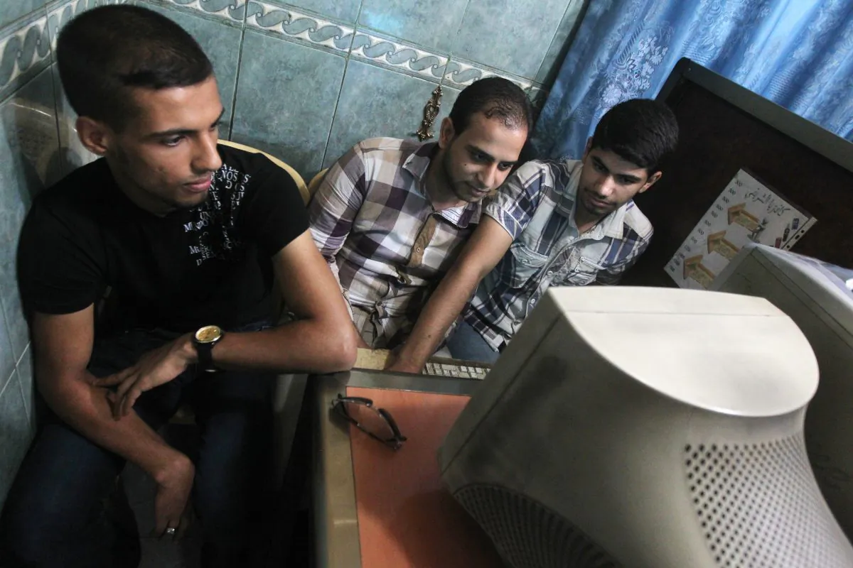 Iraqi men use a computer at an Internet cafe in Baghdad on June 26, 2012. (Ahmad Al-Rubaye/AFP/Getty Images)