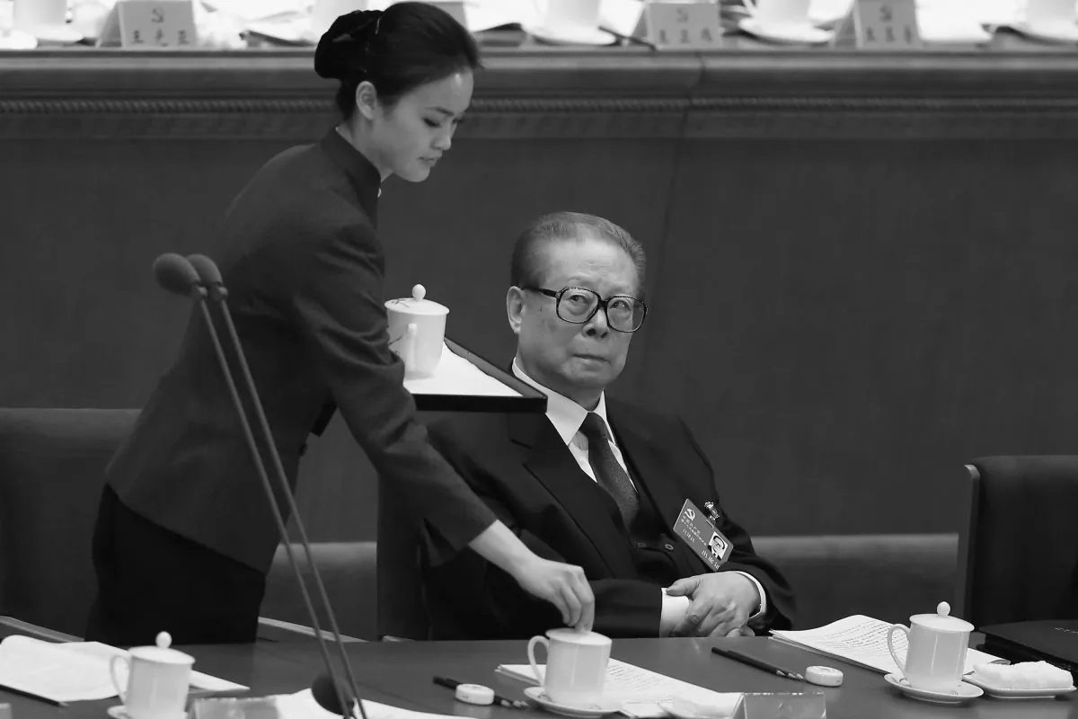 Former Chinese Communist Party Jiang Zemin (R) attends the opening session of the 18th Communist Party Congress held at the Great Hall of the People on Nov. 8, 2012 in Beijing, China. Rumors of Jiang and his mistresses have been passed around on Chinese internet unhampered, in contravention to custom. (Feng Li/Getty Images)