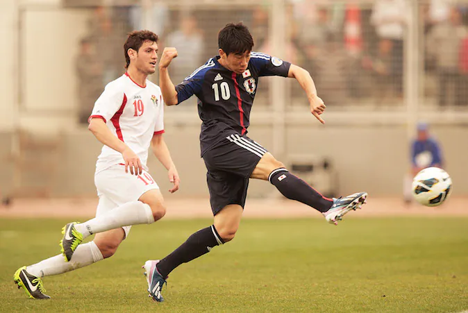 Shinji Kagawa of Japan scores Japans only goal during the FIFA World Cup Asian qualifier match between Jordan and Japan at King Abdullah International Stadium on March 26, 2013 in Amman, Jordan. (Photo by Adam Pretty/Getty Images)