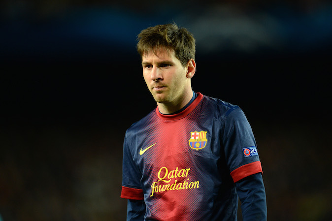 How much does Lionel Messi earn at Barcelona?