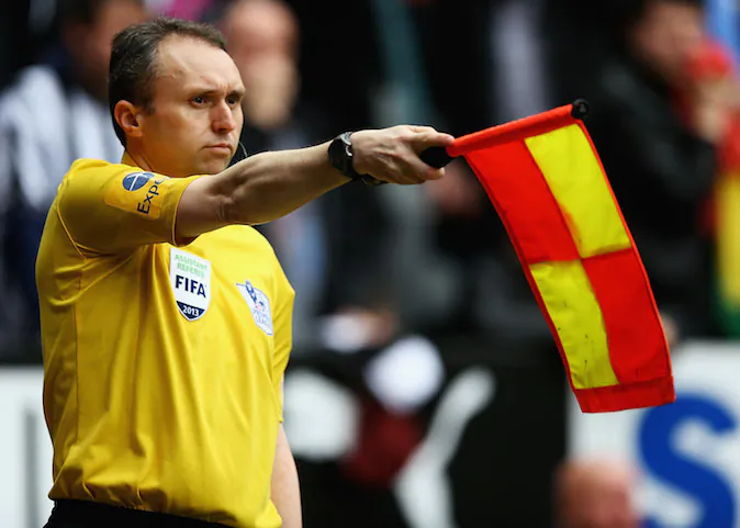 Assistant referee D Cann, awards Papiss Demba Cisse of Newcastle United offside during the Barclays Premier League match between Newcastle United and Sunderland at St James' Park on April 14, 2013 in Newcastle upon Tyne, England. (Matthew Lewis/Getty Images)