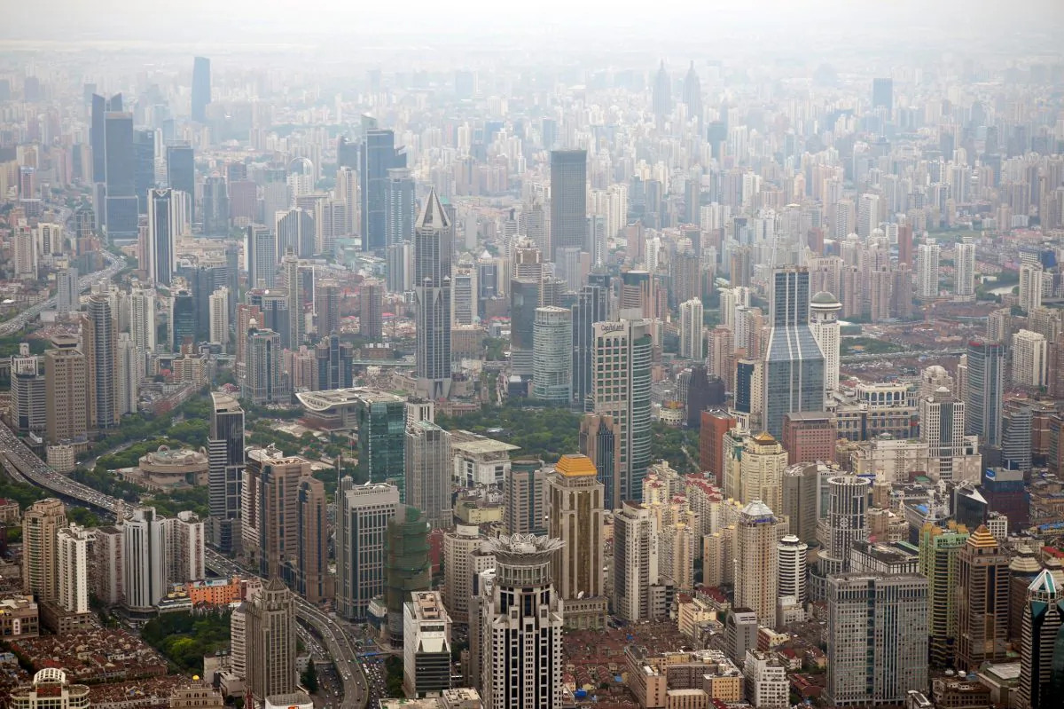 This photo taken on August 2, 2013 shows commercial and residential property from the under construction Shanghai Tower in Pudong, Shanghai. Chinese property prices increased at a faster rate in September than the previous month as the effect of price-control policies weakened, a survey said on September 30. (Peter Parks/AFP/Getty Images)