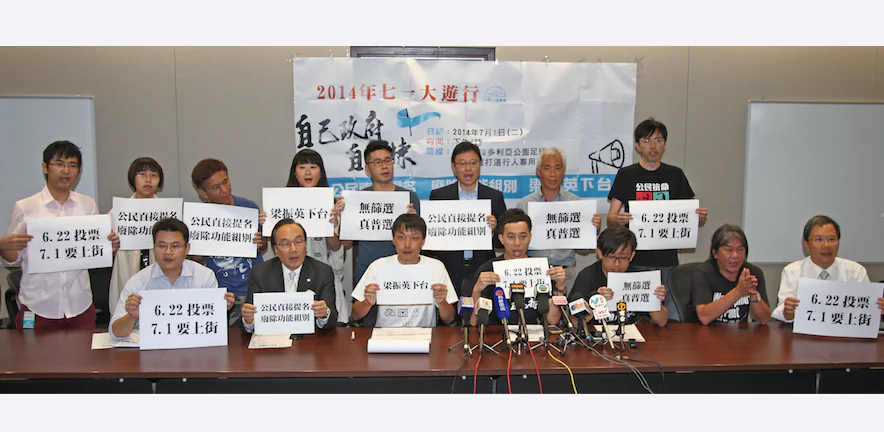 Civil Human Right Front (CHRF) holds a press conference on June 5, 2014 to announce information regarding the July 1 protest rally. Protesters are holding appeal signs in Chinese that translate to “Vote on June 22, Take to the street on July 1” “Step Down, Leung Chun-ying” “No Screening, (We demand) True Universal Suffrage” “Citizens nominate directly, abolish the functional constituency”. (Epoch Times)