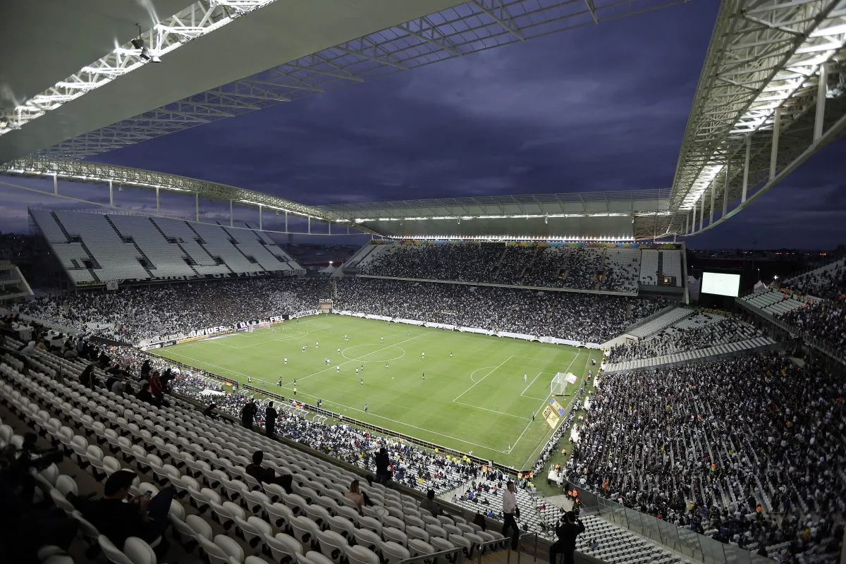 Corinthians's and Botafogo players battle it out during a Brazilian soccer league match at the Itaquerao, the stadium that will host the World Cup opener match between Brazil and Croatia on June 12, in Sao Paulo, Brazil, Sunday, June 1, 2014. (AP Photo/Andre Penner)