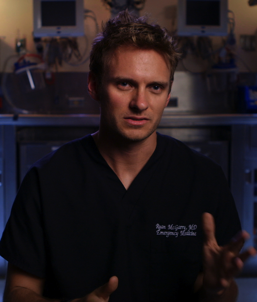 ER doctor in blue scrubs in "Code Black"