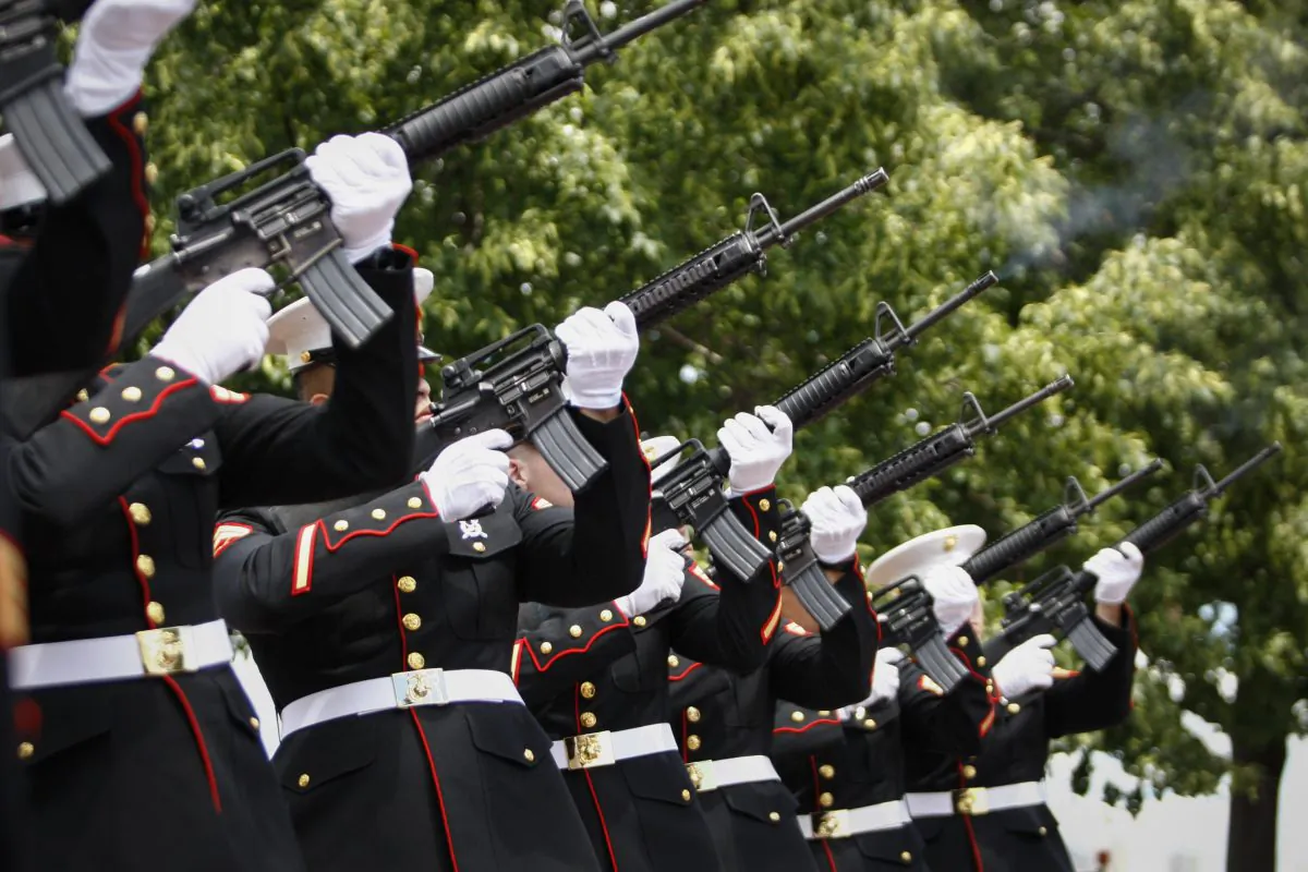 A group of Marines fire their arms during the Commemorating 70th Anniversary of D-Day on June 06, 2014 in New York City. Three helicopters have showered 1 million rose petals on the Statue during a event organized by the organization 'The French Will Never Forget' to mark the 70th anniversary of World War II D-Day landings. (Kena Betancur/Getty Images)