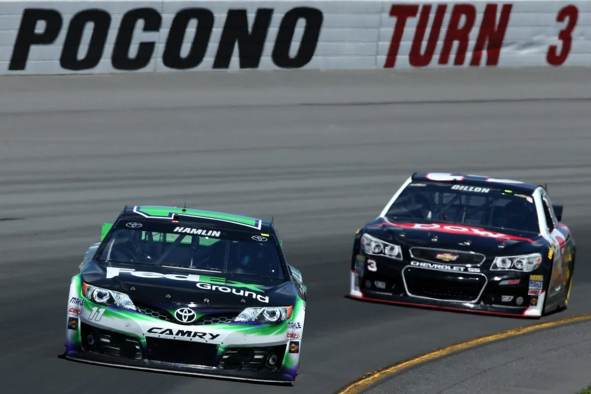 Denny Hamlin, driver of the #11 FedEx Ground Toyota, leads Austin Dillon, driver of the #3 Dow Chevrolet, during practice for the NASCAR Sprint Cup Series Pocono 400 at Pocono Raceway on June 7, 2014 in Long Pond, Pennsylvania. (Doug Pensinger/Getty Images)