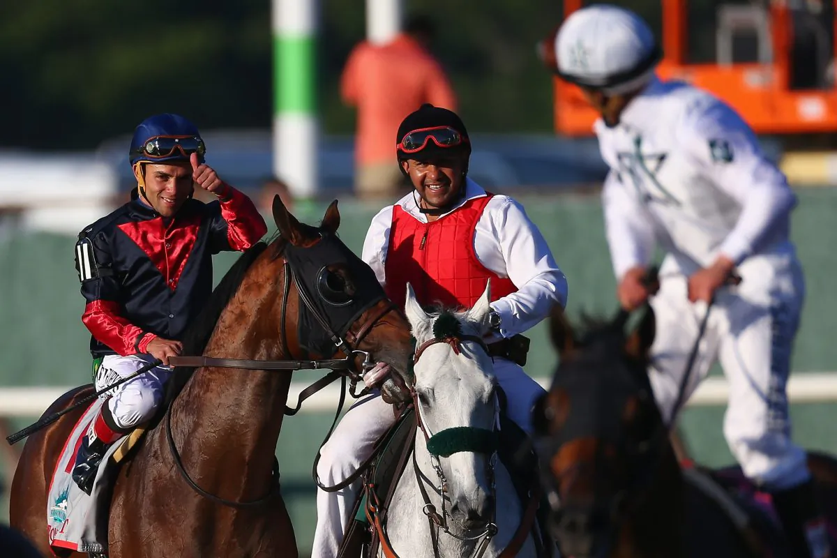 Horse Tonalist, ridden by Joel Rosario (L), after winning the 146th running of the Belmont Stakes at Belmont Park in Elmont,
N.Y., on June 7, 2014.