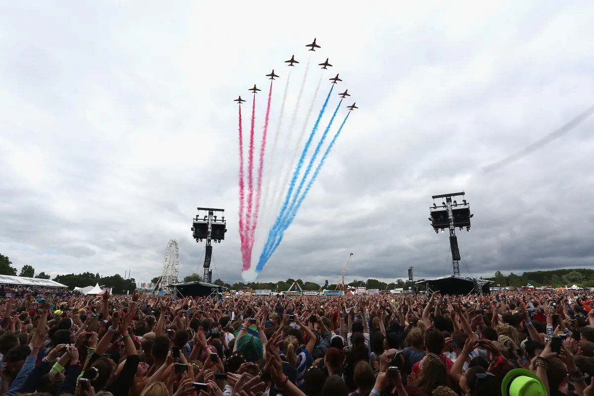The Red Arrows fly over the crowd at The Isle of Wight Festival at Seaclose Park in Newport, Isle of Wight on June 14, 2014. (Tim P. Whitby/Getty Images)