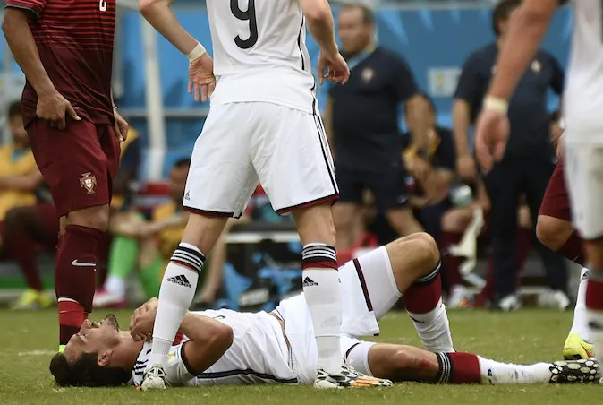 Germany's defender Mats Hummels is injured during the Group G football match between Germany and Portugal at the Fonte Nova Arena in Salvador during the 2014 FIFA World Cup on June 16, 2014. (ODD ANDERSEN/AFP/Getty Images)