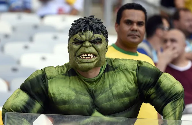A fan dressed as fictional superhero Hulk cheers prior to a Group H football match between Belgium and Algeria at the Mineirao Stadium in Belo Horizonte during the 2014 FIFA World Cup on June 17, 2014. (MARTIN BUREAU/AFP/Getty Images)