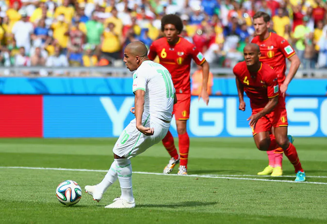  Sofiane Feghouli of Algeria scores his team's first goal on a penalty kick during the 2014 FIFA World Cup Brazil Group H match between Belgium and Algeria at Estadio Mineirao on June 17, 2014 in Belo Horizonte, Brazil. (Photo by Jeff Gross/Getty Images)