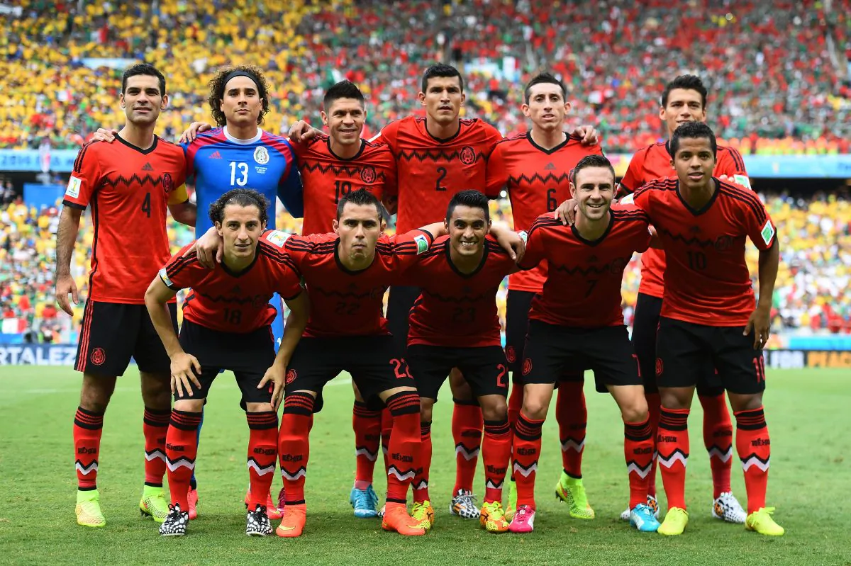 Mexico pose for a team photo prior to the 2014 FIFA World Cup Brazil Group A match between Brazil and Mexico at Castelao on June 17, 2014 in Fortaleza, Brazil. (Photo by Laurence Griffiths/Getty Images)