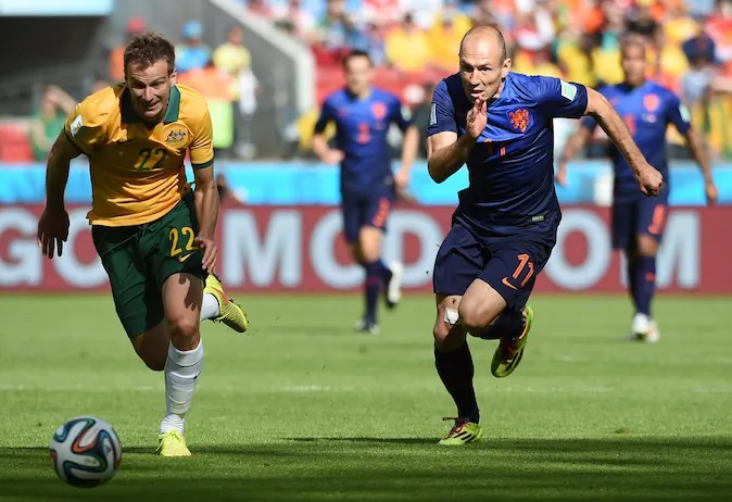 Netherlands' forward Arjen Robben (R) vies with Australia's defender Alex Wilkinson during a Group B football match between Australia and the Netherlands at the Beira-Rio Stadium in Porto Alegre during the 2014 FIFA World Cup on June 18, 2014. (WILLIAM WEST/AFP/Getty Images)