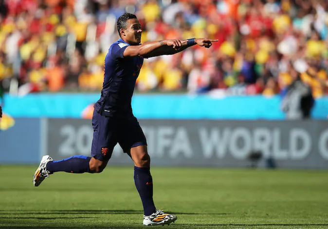 Memphis Depay of the Netherlands celebrates scoring his team's third goal during the 2014 FIFA World Cup Brazil Group B match between Australia and Netherlands at Estadio Beira-Rio on June 18, 2014 in Porto Alegre, Brazil. (Photo by Dean Mouhtaropoulos/Getty Images)