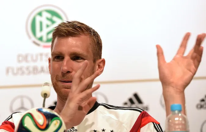 Germany's defender Per Mertesacker gestures during a press conference in Santo Andre on June 19, 2014 as part of the FIFA 2014 World Cup in Brazil. (PATRIK STOLLARZ/AFP/Getty Images)