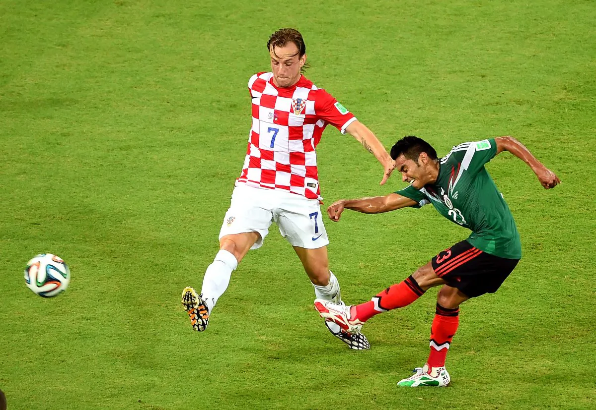 Ivan Rakitic of Croatia and Jose Juan Vazquez of Mexico compete for the ball during the 2014 FIFA World Cup Brazil Group A match between Croatia and Mexico at Arena Pernambuco on June 23, 2014 in Recife, Brazil. (Photo by Laurence Griffiths/Getty Images)