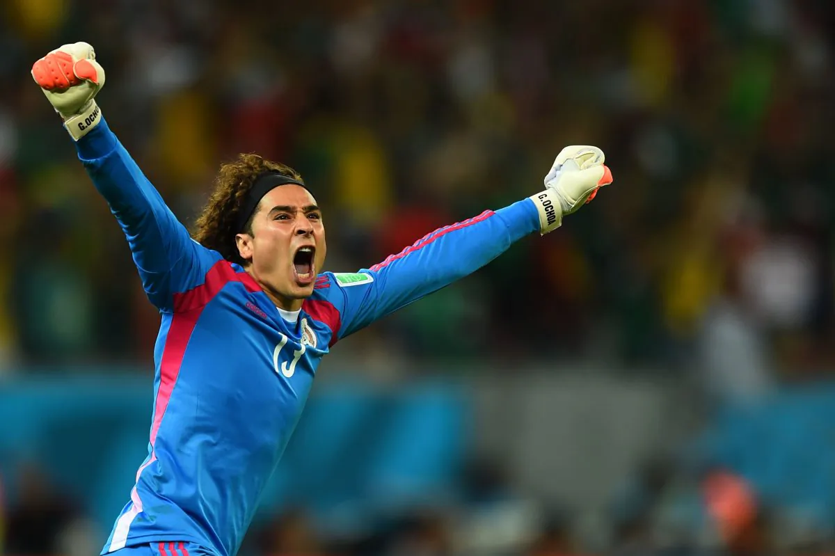 Guillermo Ochoa of Mexico celebrates his team's first goal during the 2014 FIFA World Cup Brazil Group A match between Croatia and Mexico at Arena Pernambuco on June 23, 2014 in Recife, Brazil. (Photo by Jamie McDonald/Getty Images)