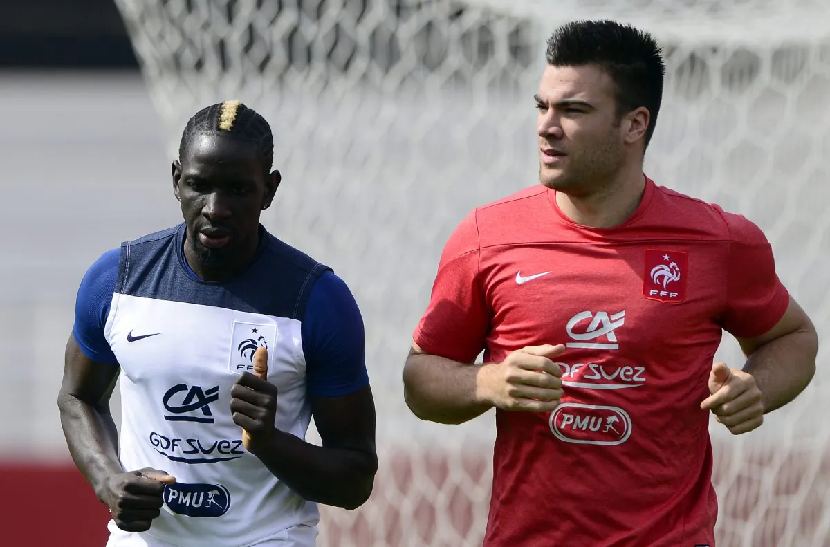 France's defender Mamadou Sakho (L) runs with a staff member during a training session at the stadium Santa Cruz in Ribeirao Preto on June 28, 2014, during the 2014 FIFA World Cup in Brazil. (FRANCK FIFE/AFP/Getty Images)