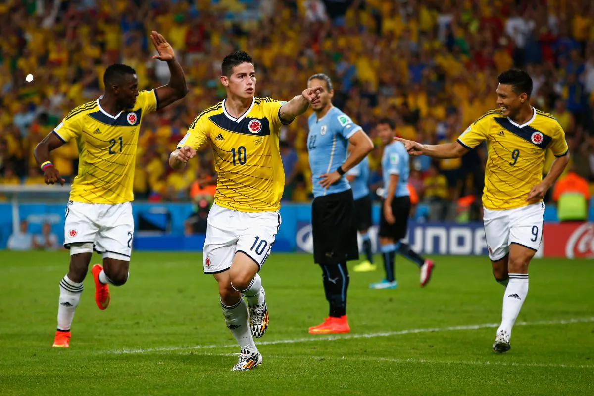 James Rodriguez of Colombia (C) celebrates scoring his team's second goal and his second of the game with teammates Jackson Martinez (L) and Teofilo Gutierrez during the 2014 FIFA World Cup Brazil round of 16 match between Colombia and Uruguay at Maracana on June 28, 2014 in Rio de Janeiro, Brazil. (Clive Rose/Getty Images)