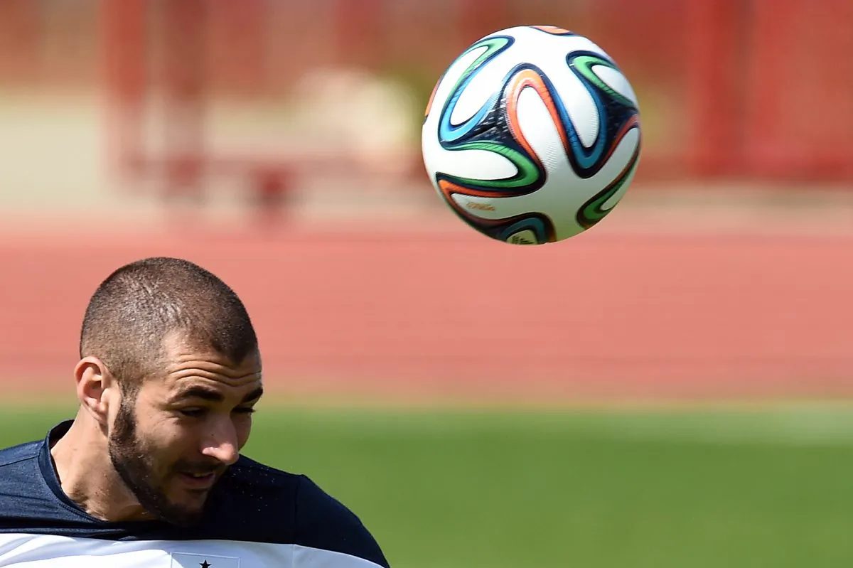 France's forward Karim Benzema heads the ball during a training session in Brasilia on June 29, 2014, on the eve of their FIFA 2014 World Cup Round of 16 football match against Nigeria. (JEWEL SAMAD/AFP/Getty Images)