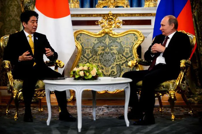 Prime Minister Shinzo Abe and President Vladimir Putin during their meeting in Moscow in 2013 (Source: ABC)