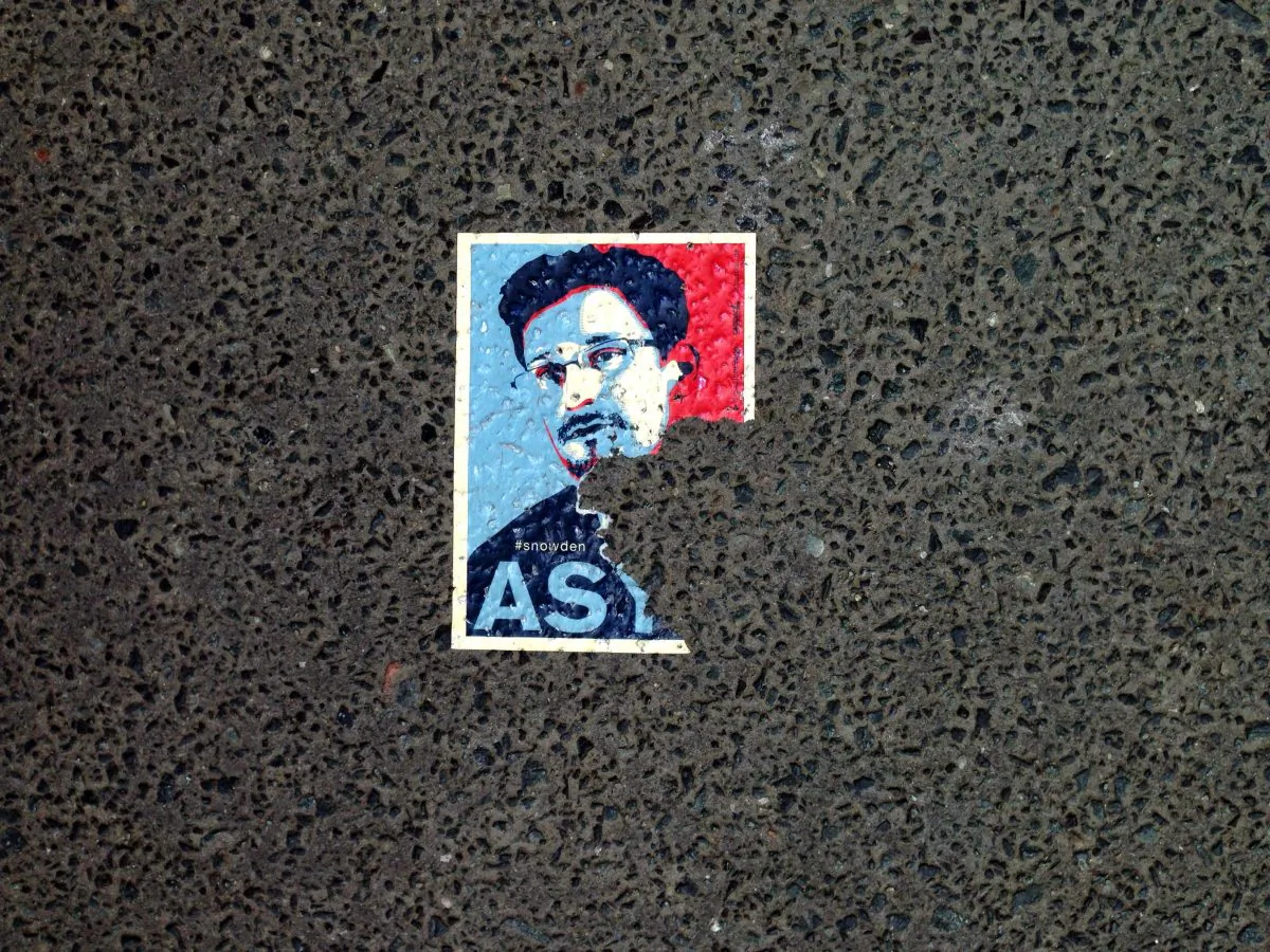A sticker featuring fugitive U.S. intelligence leaker Edward Snowden is seen on the pavement in a Berlin street, on May 26, 2014. (Odd Andersen/AFP/Getty Images)