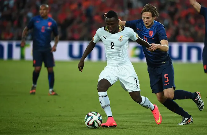 Ghana's defender Samuel Inkoom (L) vies with Netherlands' midfielder Daley Blind during the international friendly football match Netherlands against Ghana on May 31, 2014 at the Kuip Stadium in Rotterdam. (DAMIEN MEYER/AFP/Getty Images)