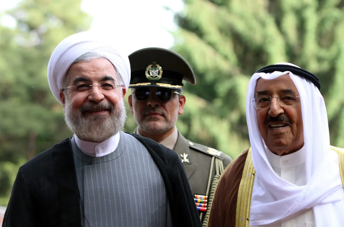 Iranian President Hassan Rouhani (L) and Emir of Kuwait, Sheikh Sabah al-Ahmad al-Sabah (R) review the honor guard during a welcoming ceremony for the Emir upon his arrival in Tehran on June 1, 2014. Kuwait's Emir started a landmark visit to Tehran focused on mending fences between Shiite Iran and the Sunni-ruled monarchies in the Gulf. (Atta Kenare/AFP/Getty Images)