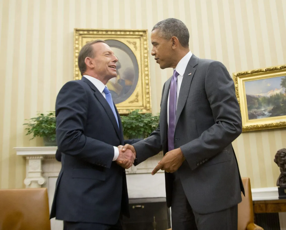 President Barack Obama shakes hands with Australian Prime Minister Tony Abbott following the conclusion of their meeting in the Oval Office of the White House in Washington, Thursday, June 12, 2014. (AP Photo/Pablo Martinez Monsivais)