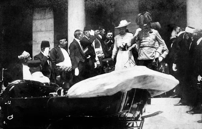 In this June 28, 1914, photo the Archduke of Austria Franz Ferdinand (C-R) and his wife Sophie walk to their a car in Sarajevo. This photo was taken minutes before the assassination of the Archduke and his wife, an event which set off a chain reaction of events which would eventually lead to World War I. (