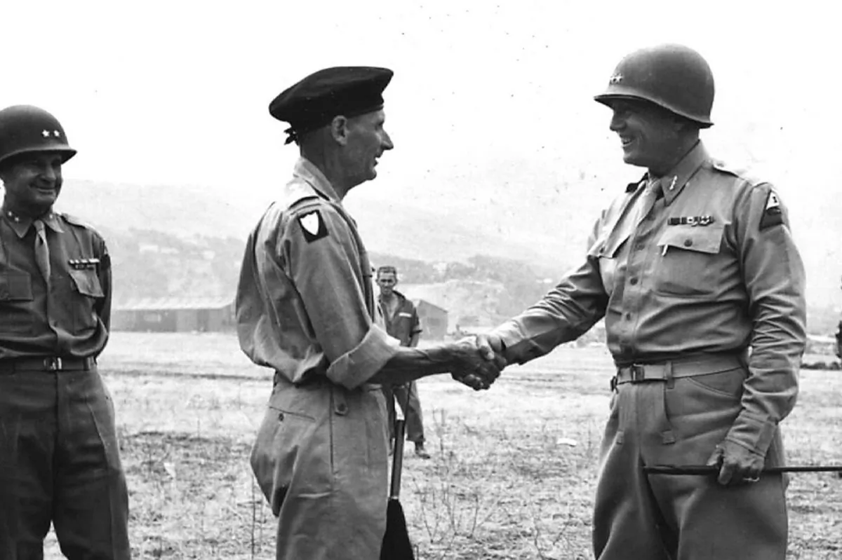July 28, 1943, General George S. Patton bids farewell to British General Bernard Montgomery at a landing strip in Palermo, Italy. (US ARMY/AFP/Getty Images)
