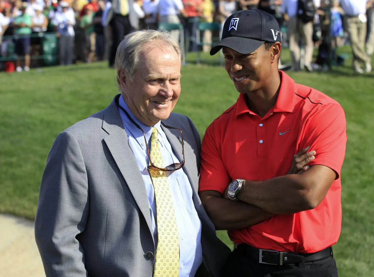 In this June 3, 2012, photo Jack Nicklaus (L) talks with Tiger Woods after Woods won the Memorial golf tournament at the Muirfield Village Golf Club in Dublin, Ohio. Nicklaus was in his customary spot behind the 18th green at Muirfield Village, waiting on the winner - or in this case, the survivor. Given the meltdowns by top players, this year without Tiger Woods has shown that it's really hard to win or that Woods was really good at it. (AP Photo/Tony Dejak)
