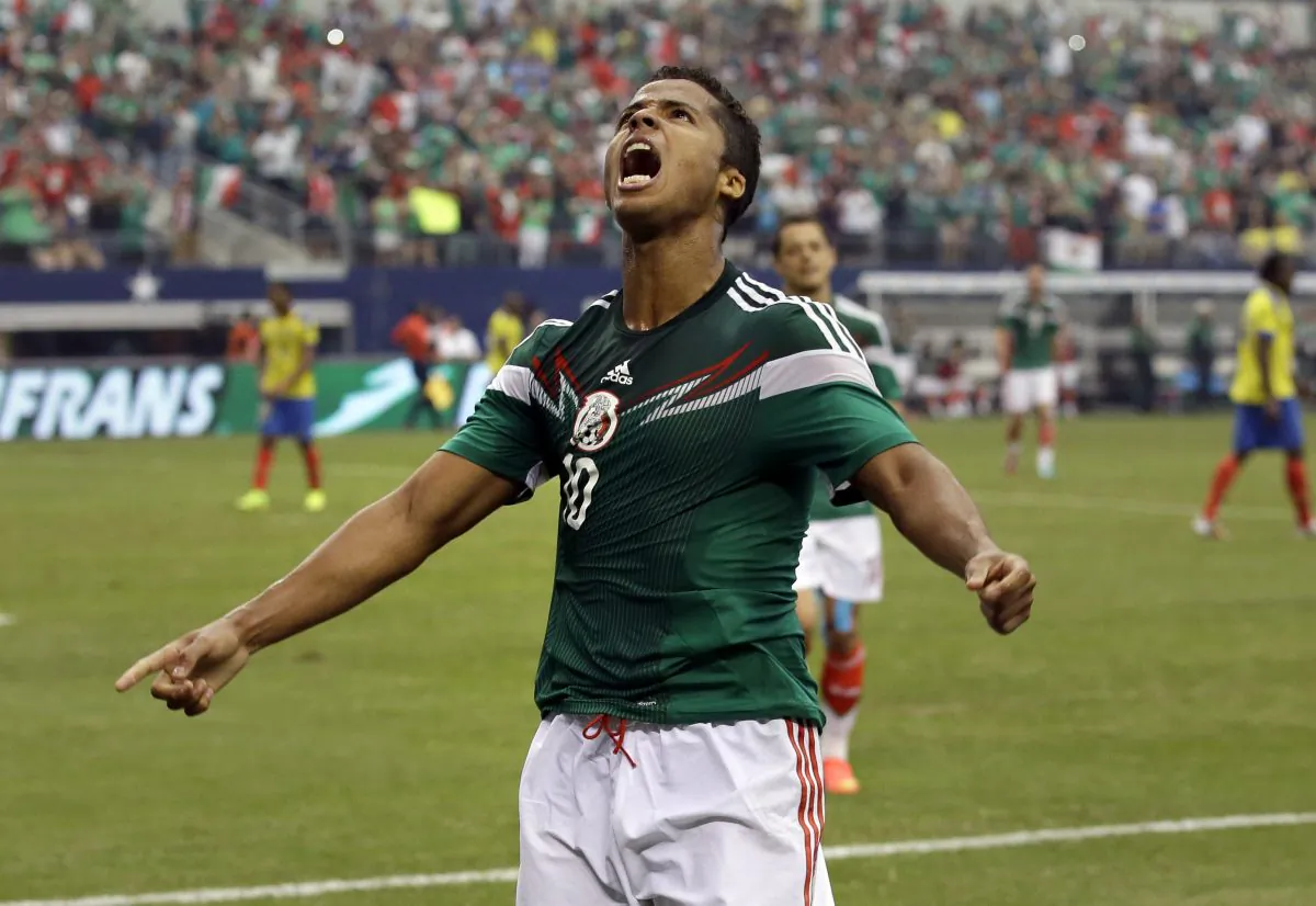 Mexico's Giovani dos Santos (10) celebrates after scoring a goal against Ecuador in the second half of a friendly soccer match Saturday, May 31, 2014, in Arlington, Texas. Mexico won 3-1. (AP Photo/Tony Gutierrez)