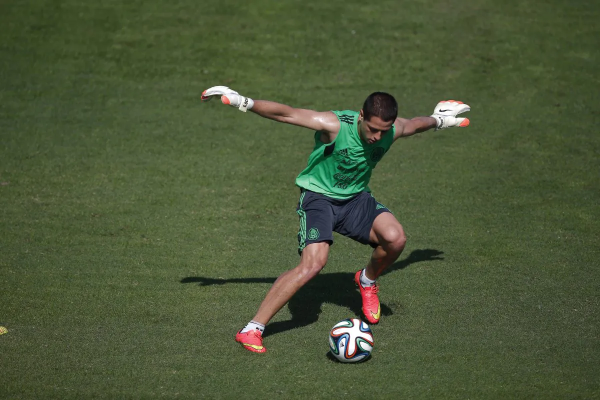 Mexico's national soccer team player Javier Hernandez fights for the ball during a training session in Santos, Brazil, Sunday, June 8, 2014. Mexico play in group A of the 2014 soccer World Cup. (AP Photo/Eduardo Verdugo)