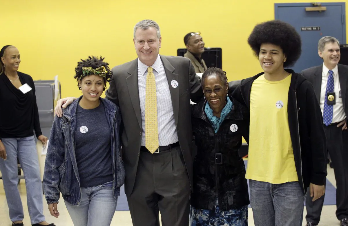 Bill de Blasio and his wife Chirlane McCray and children Dante (R) and Chiara (L) at a polling station in Park Slope, Brooklyn, Nov. 5, 2013. (Mark Lennihan/AP)